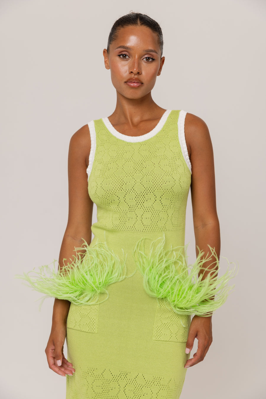 andreeva green knit dress with feathers