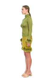 Green knit turtleneck with handmade knit details
