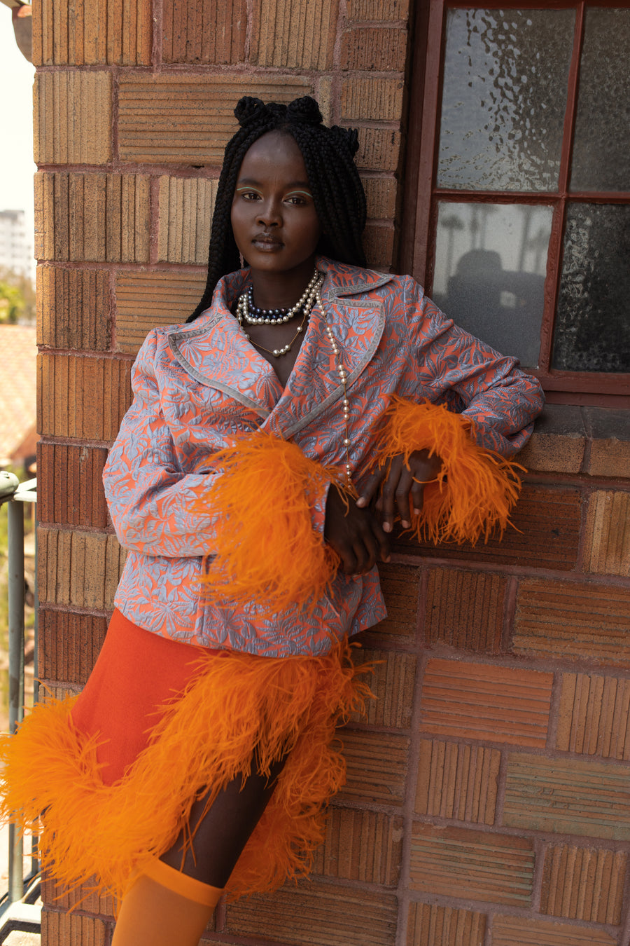 andreeva orange jacket with feathers